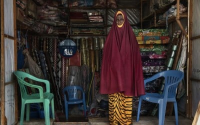 In Medina Market, Somalia, Hodan*, a member of the Self-Help Group (SHG) supported by CONCERN, is seen in her shop. She sells mattress, pillows chairs, flowers, mosquito nets. Photo: Marco Gualazzini/ Concern Worldwide.