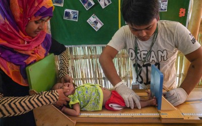 Concern staff in Cox's Bazar screen Azara* for malnutrition. Photo: Abir Abdullah / Concern Worldwide.