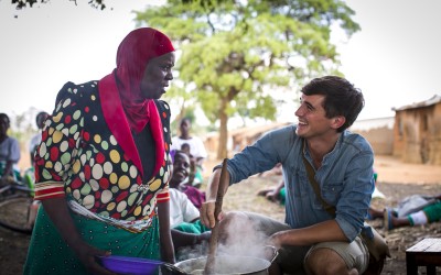 Food writer, photographer and TV presenter Donal Skehan with 'lead mothers' who are trained by Concern Wolrdwide on nutrition and teach women in the Kachere Care Group about how to make a nutritious meal for their families with five major food groups. Location: Kaigwanga Village, Mchinji, Malawi. Photo: Jennifer Nolan / Concern Worldwide.