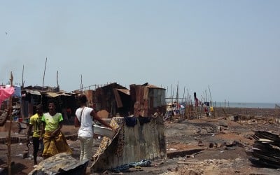 Residents rebuild their homes at the Kroo Bay slum.
