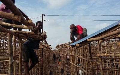 Residents rebuild their homes at the Kroo Bay slum.