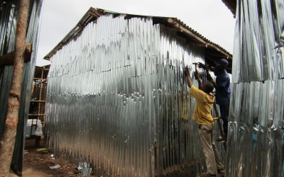 Residents rebuild their homes at the Kroo Bay slum.