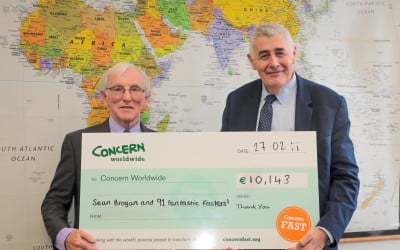 Cavan native Sean Brogan with Concern Worldwide CEO Dominic MacSorley at Concern's Dublin headquarters presenting his cheque for €10,143