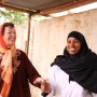 Mary Robinson with healthworker Nadhifa Ibrahim Mohamed. She has worked in Dollow Health Centre  for 3 years and is a certified midwife, Dollow, Somalia. The Somali district of Dollow is situated on the Somali / Ethiopian border.  Dollow town, the district capital, is the border crossing point and is contiguous with Dollow Ado on the Ethiopian side. Dollow is a key transit point between Somalia and Ethiopia in the current crisis with over 1,700  crossing between the two countries on a daily basis. To date 7