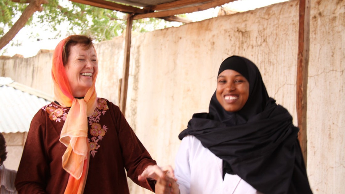 Mary Robinson with healthworker Nadhifa Ibrahim Mohamed. She has worked in Dollow Health Centre for 3 years and is a certified midwife, Dollow, Somalia. The Somali district of Dollow is situated on the Somali / Ethiopian border. Dollow town, the district capital, is the border crossing point and is contiguous with Dollow Ado on the Ethiopian side. Dollow is a key transit point between Somalia and Ethiopia in the current crisis with over 1,700 crossing between the two countries on a daily basis. To date 7