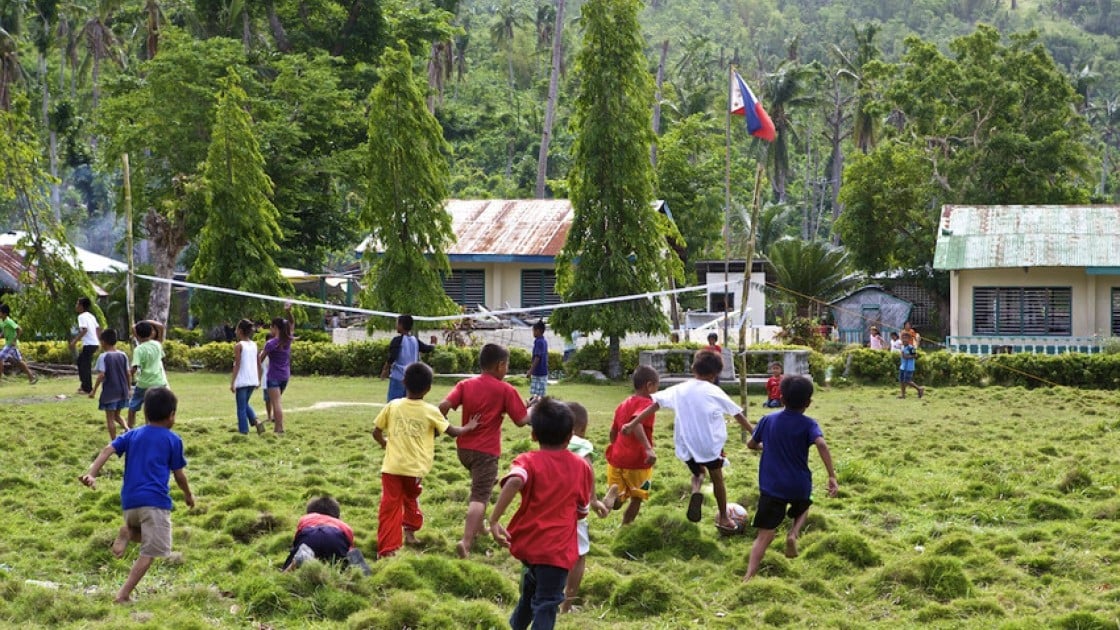 Children at the elementary school in Polopina play soccer