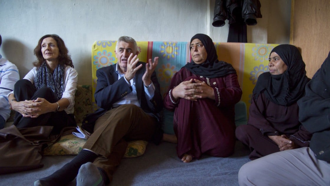 Dominic MacSorley pictured with Syrian refugees in Lebanon.