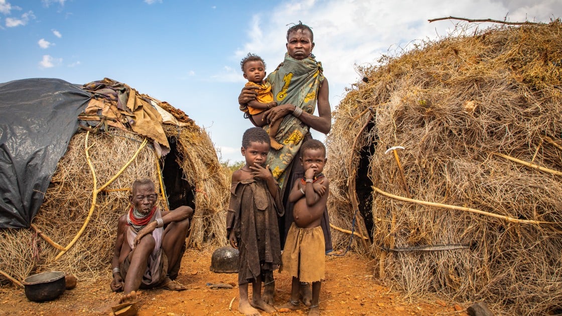 Ng’ikario Ekiru with her mother-in-law Nakode and three of her children, Aukot, Ekuam and Apua. The family from Turkana county in northern Kenya have lost almost their entire herd of goats to recurrent droughts and are relying on wild fruits for their survival.Photo: Gavin Douglas / Concern Worldwide.