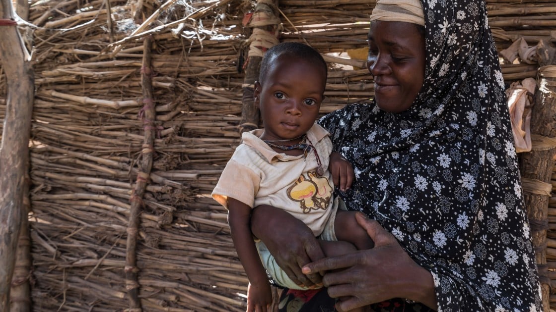 Rouaya with her son Salouhou at their home. Salouhou has just been admitted into Concern’s nutrition programme and has started treatment for Severe Acute Malnutrition. Photo: Apsatou Bagaya / Concern Worldwide.