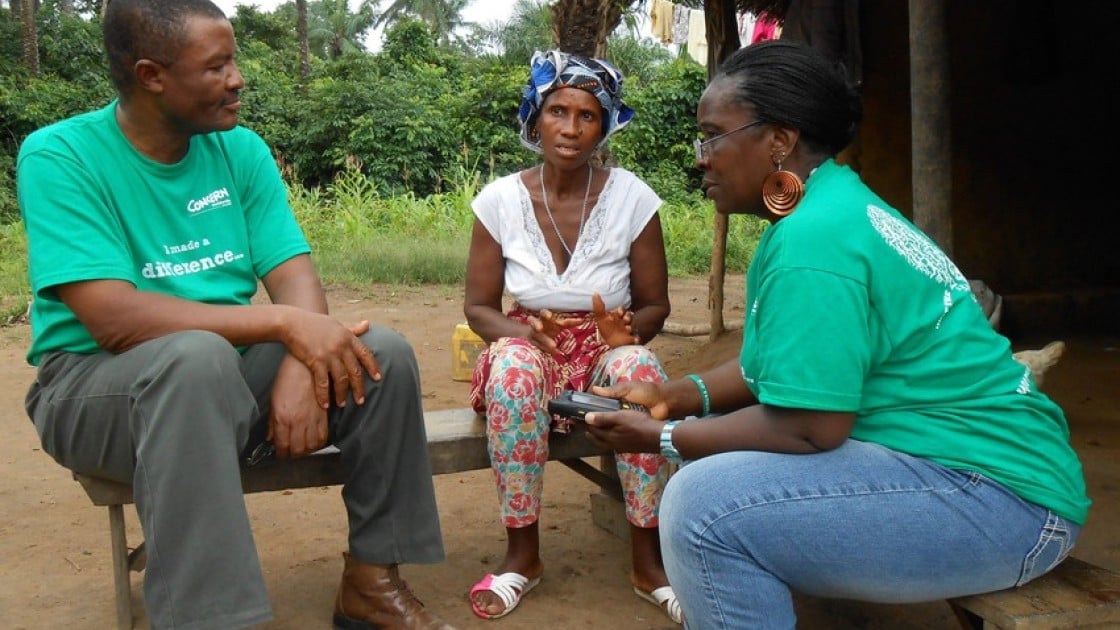 Theresa Maurice Ojong – M&E Officer, Child Survival Programme & Albert Yanguba - Operations Research Advisor, interviewing Aminata Mansaray – beneficiary in Baoma Village, Waterloo, Western Area, Sierra Leone for live data collection. Photo: Ciarán Walsh / Concern Worldwide.
