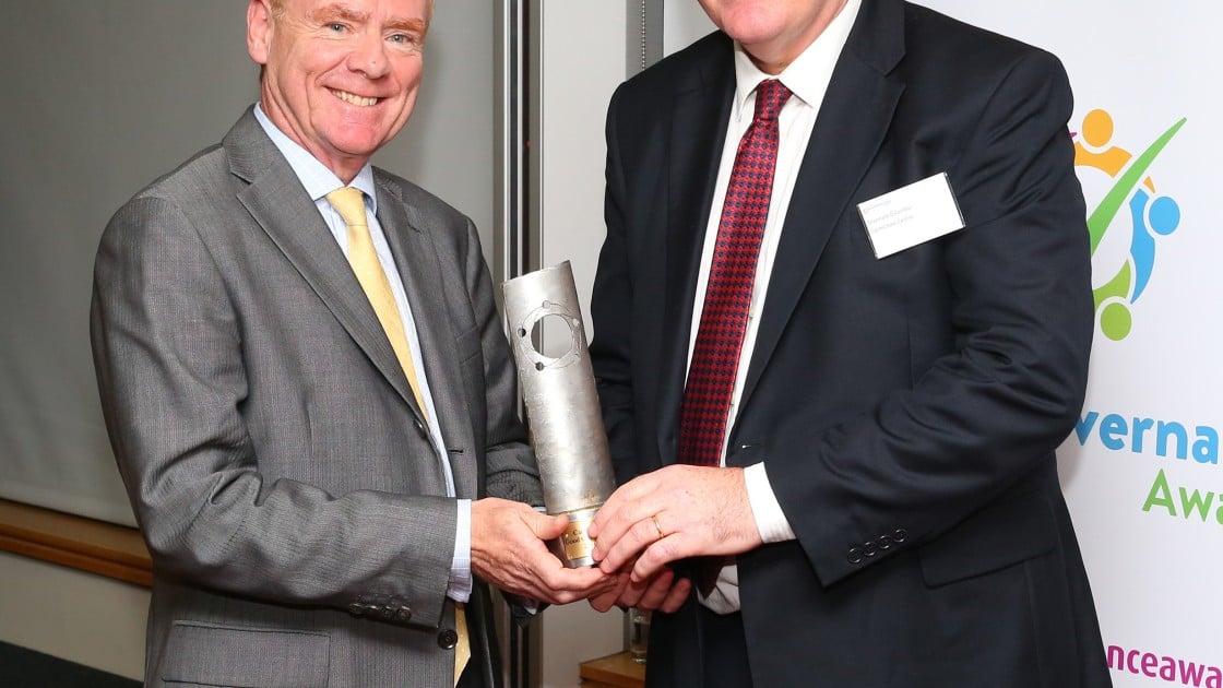 Concern's chairperson Tom Shipsey accepts a Special Recognition award from Diarmaid O'Corrbui, CEO of the Carmichael Centre at the Good Governance Awards. Photo: Marc O'Sullican/Concern Worldwide.
