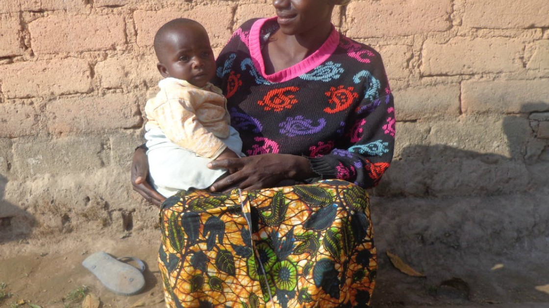 Thecla Abdul Lugenge with her youngest child Asha in Mfriga village, Mfriga ward, Njombe district, Irigna region. Photograph taken by: Lydia Mushengezi/Concern Worldwide.