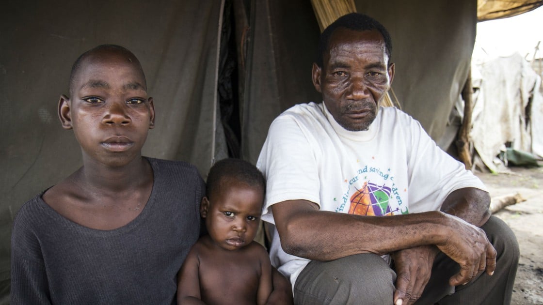 Saide in Namacurra with his children after the flood in his district of Zambezia, Mozambique. Photo taken by Crystal Wells/Concern Worldwide