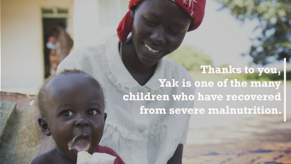 Yak sits in his mother, Achara, and eats ready-to-eat therapeutic foods at Mayom Health Care Unit in Aweil West County, Northern Bahr el Gazal, South Sudan. Photo: Crystal Wells/Concern Worldwide.