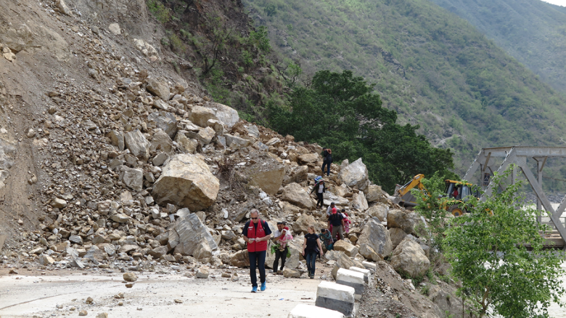 Bulldozers work to re-open a bridge at Khurkot, Ramechhap. Photo taken by Helvetas.