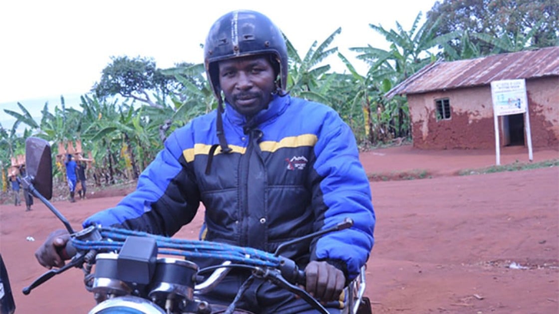 Bernard Kamuhanda, a volunteer in agricultural development, on his motorcycle taxi in Nterwenge, Tanzania. Photo taken by Concern Worldwide.