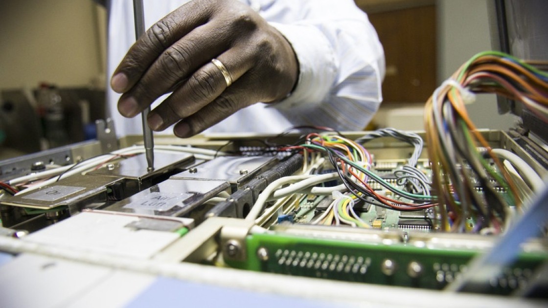 Engineers at Kenyatta Hospital in Nairobi work to repair broken medical equipment. Photo: Concern Worldwide.