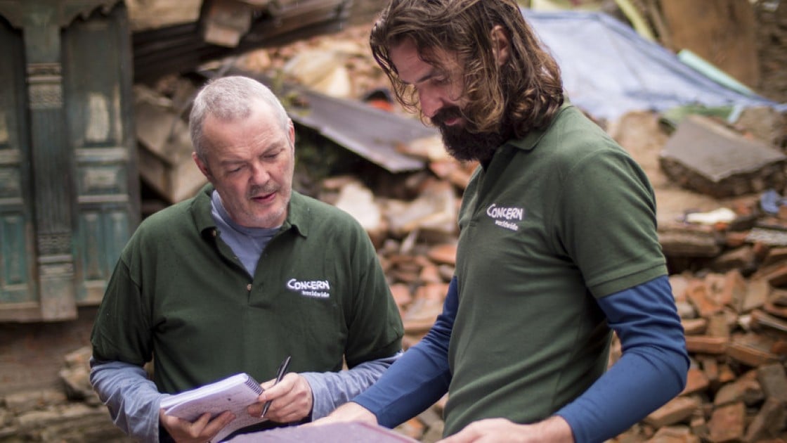 Ros O'Sullivan speaking to Graham Woodstock in Kathmandu, just after the 2015 earthquake struck. Photo: Concern Worldwide.