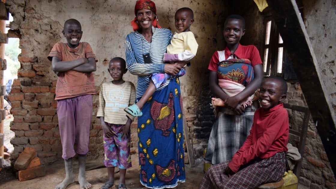 Just a few months after joining Concern’s Graduation programme, Violette Bukeyeneza (pictured here with her family) started a small business selling banana juice. Photo: Darren Vaughan / Concern Worldwide.