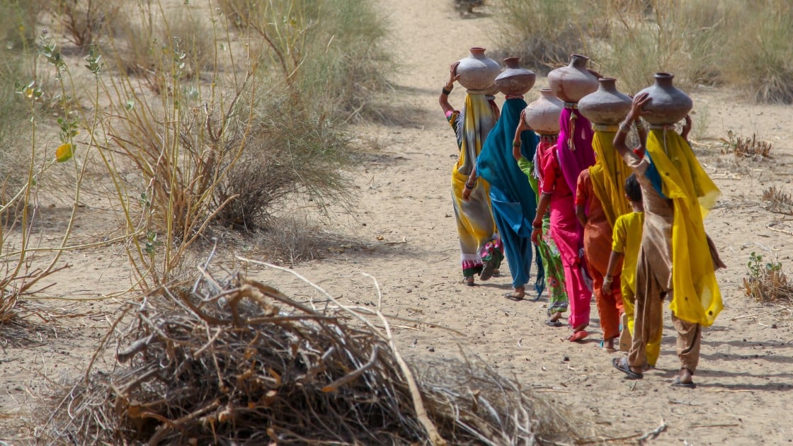 Community women carrying water in mud pots from the communal well Umerkot district Sindh province Pakistan April 2017 (00000003).jpg
