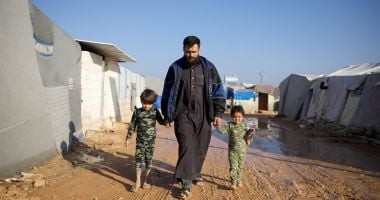 Man with children in Syria