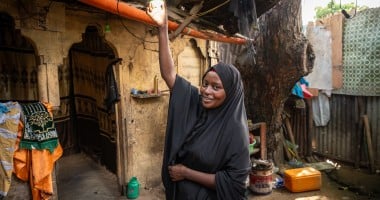 Idil* turning on the solar light she received as part of the Green graduation programme by Concern. (Photo: Mustafa Saeed/Concern Worldwide)