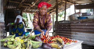 Favor B Tarr, with some of the produce from her vegetable farm at Kaytor Town, Grand Bassa, Liberia. The community is being supported by Concern in an integrated programme called IFANCI, funded by the LDSCC. (Photo: Kieran McConville/Concern Worldwide)