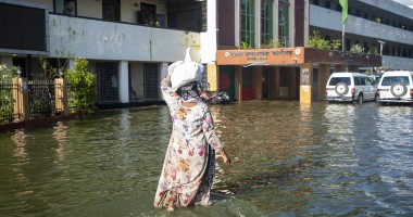 A woman outside the office of Deputy Commissioner in Noakhali district, Bangladesh with flood response materials. Photo: Akram Hossain/Concern Worldwide