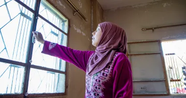 Darine* and her husband want to move where her kids can get an education. Concern has put windows in their apartment to help keep the cold out. (Photo: Gavin Douglas/Concern Worldwide)