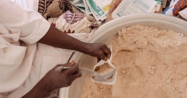 Production of MISOLA® Enriched Flour. Fifteen women from the Afani Yara Women's Group work on the production of Misola. Each 500gr bag sells at 500 cfa. Each child needs 100 gram/day of food supplement for 5 days for recovery. (Photo: Ollivier Girard/Concern Worldwide)