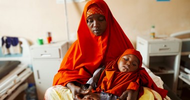Halima* (40) and her baby Shukri* attend their local health centre. Halima* lives in Igadabagey IDP site in Marka with her five children (3 boys and 2 girls). Halima* was a farmer in Lower Shabelle area but Halima* and her family were displaced after the drought and moved to the IDP site in 2022. Photo: Adnan Mohamed/Concern Worldwide