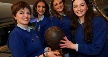 Four people from Ursuline Secondary School holding a trophy after winning Concern Debate final 2026