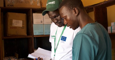 Health and Nutrition Manager Luka Malek Mur and Health Facility Officer checking registers in Northern Bahr al Ghazal, South Sudan. Photo: Hannah Bolder/Concern Worldwide