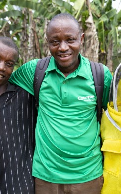 Concern Livelihoods Officer Benjamin Bundor with Daniel Johnson (L) and David Gargar at the beekeeping project in Neakai community Photo: Kieran McConville/Concern Worldwide