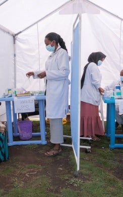 Martha Tesfaye (L) and Tesfaye Maeregu (R-seated) at a mobile health and nutrition clinic in Dessie Zuria Woreda, Amhara Regional State