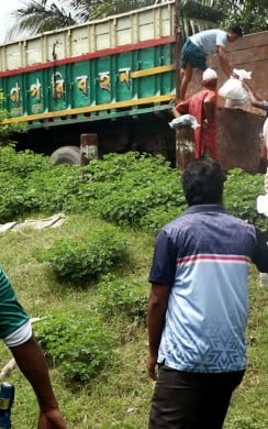 Concern Emergency team members unloading humanitarian assistance in Noakhali district