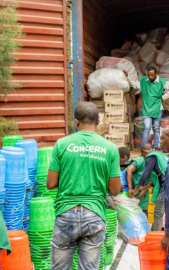 Concern staff members organise the distribution of household and hygiene kits as part of the SAFER programme, funded by FCDO. Photo: Samuel Isenge/Concern Worldwide