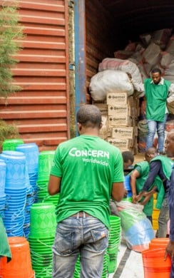Concern staff members organise the distribution of household and hygiene kits as part of the SAFER programme, funded by FCDO. Photo: Samuel Isenge/Concern Worldwide