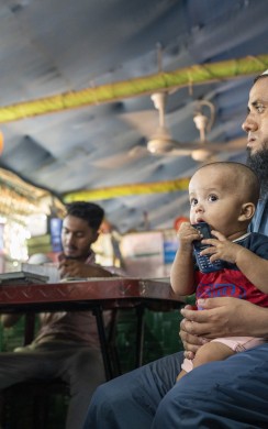Md. Ali* (26) a Rohingya father visiting Concern nutrition centre with his child Sohel (4 months). Camp 13, Ukhiya, Cox's Bazar. (Photo: Saikat Mojumder/Concern Worldwide)