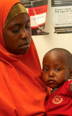 Amburo* (28) holds her youngest child Abshir*. Amburo is a mother of four children from Baidoa, now living in a displacement camp in Daynile District, Mogadishu. Photo: Adnan Mohamed/Concern Worldwide