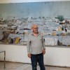 Irish artist Brian Maguire pictured alongside paintings which were inspired following his recent visit to a Protection of Civilian Camp in Bentiu, South Sudan with Concern. Photo: Concern Worldwide.