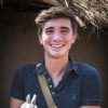 Food writer, photographer and TV presenter Donal Skehan holding a rabbit which has been given to a family as a Concern Gift. Rabbits have a habit of multiplying, and that makes them a great resource. Three rabbits like these will soon become thirty-three, and the income they bring will help a family feed, clothe and educate their own little ones. Location: Nakumba District, Lilongwe, Malawi. Photo: Jennifer Nolan