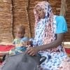 Khamissa Ibrahim is 32 years old. She has six children: Fatouma (9), Ahmad (7), Zakia (5), Aisha (4), Umaima (3) and Rafaida (1 and a half) – pictured – and is six months pregnant. Khamissa is a Concern-trained Community Health Volunteer. She also sells onions, salt, garlic, oil, okra and chili. Before Concern, she worked in the fields to support her family during the lean period. Khamissa is independent and runs her own business. She stores millet, peanut and sesame and from these stores, she loans stock t