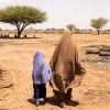 A Somali woman and her daughter inspect their field in Somaliland