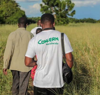 Concern team member, Sam, takes a camera to document the damage to crops in Nsendje, Malawi. Photo: Gavin Douglas/Concern Worldwide.
