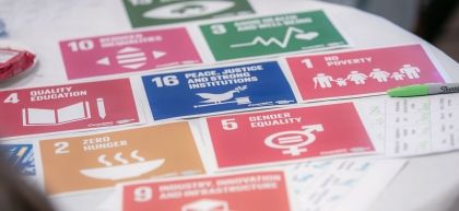 An array of Sustainable Development Goals illustrations on a table at Agents of Change event 