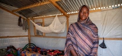 Dijda in her home in a refugee camp 