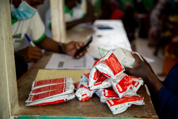 Red and white packets of ready-to-use therapeutic food on hospital counter