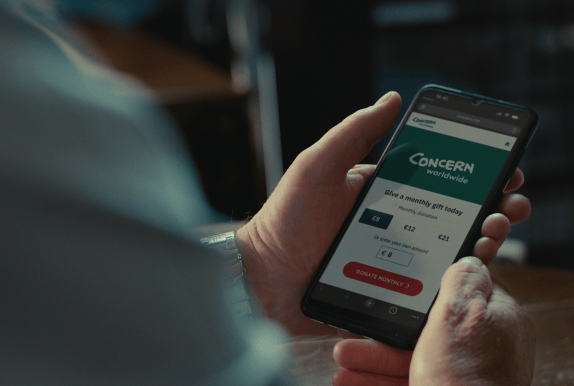 Person looking at Concern donation page on their phone
