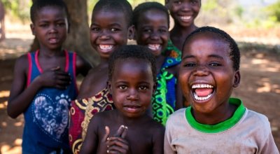 Children in Malawi gather and smile for the camera. Photo: Jennifer Nolan / Concern Worldwide.
